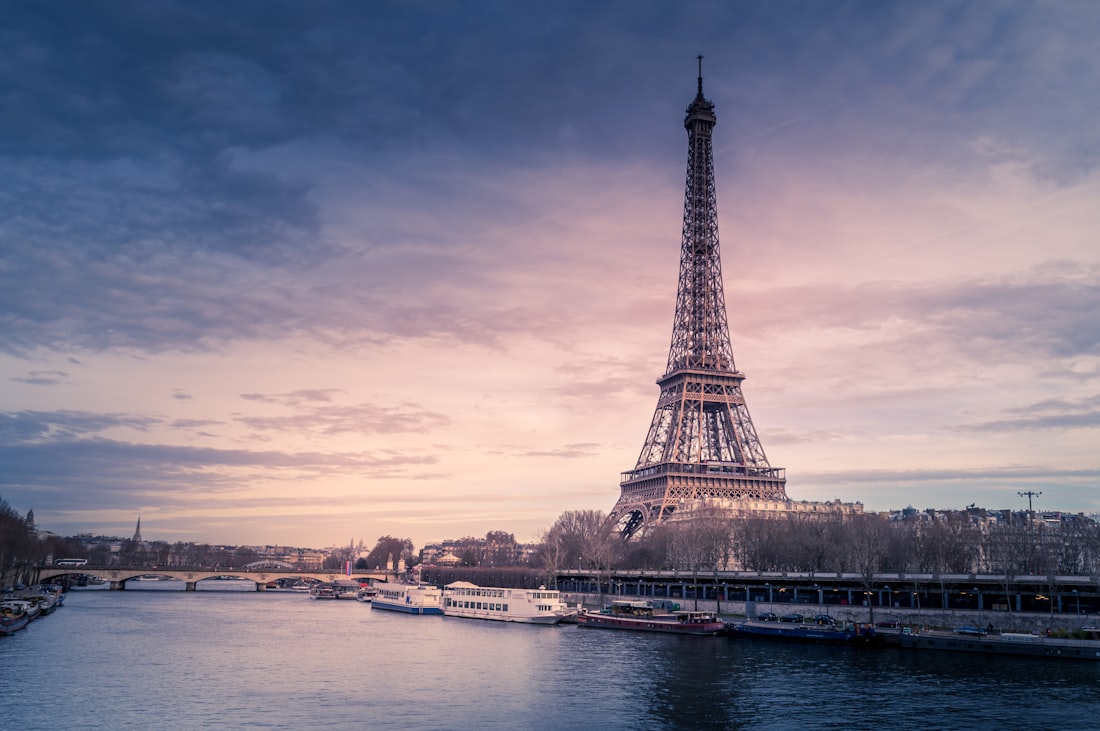 The Eiffel Tower beside the River Seine at sunset